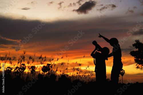silhouette of women and boy Photographer