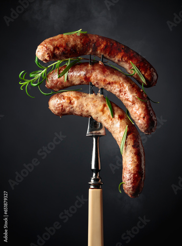 Grilled Bavarian sausages with rosemary.