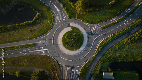 Aerial drone shot of empty roundabout off the A12 in the Netherlands. Dutch road system allows traffic to flow photo