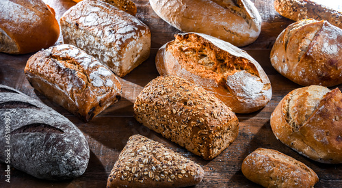 Assorted bakery products including loaves of bread and rolls