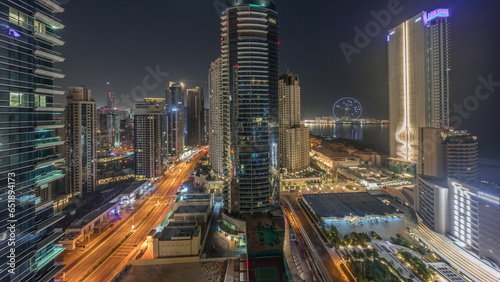 Panoramic view of the Dubai Marina and JBR area and the famous Ferris Wheel aerial night