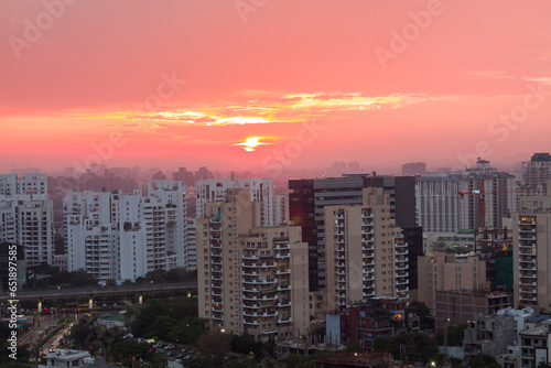 Colorful sunset in Gurgaon,Haryana,India ,Delhi NCR posh business locality with luxury commercial and residential apartments.Modern,urban architecture with aerial view. photo