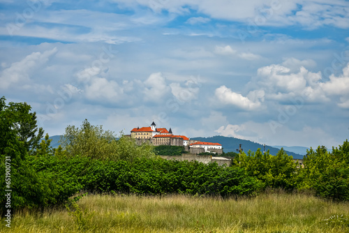 View of Palanok Castle or Mukachevo Castle and fields