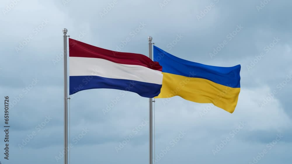 Ukraine and Netherlands flag waving together on cloudy sky, endless seamless loop, two country cooperation concept Ukraine and Netherlands flag waving together on cloudy sky, endless seamless loop, two country cooperation concept