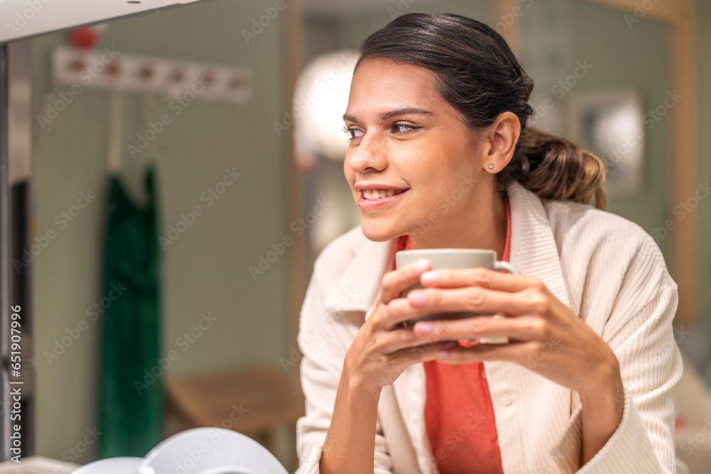 Portrait of smiling happy enjoy beauty woman relax drinking cup of hot coffee or tea,Cappuccino,Espresso,Americano,Latte.Girl felling enjoy breakfast in holiday morning vacation on bed at home Portrait of smiling happy enjoy beauty woman relax drinking cup of hot coffee or tea,Cappuccino,Espresso,Americano,Latte.Girl felling enjoy breakfast in holiday morning vacation on bed at home