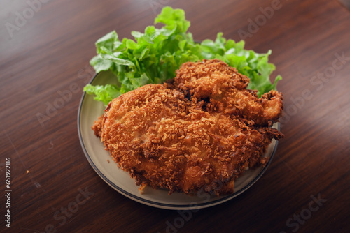 Deep fried chicken cutlet and salad vegetables