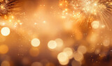 A sparkler emits shimmering light against a golden bokeh background.