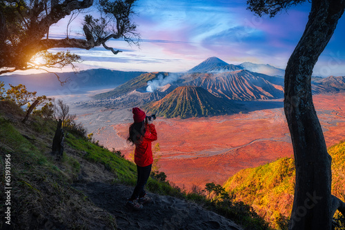 Travelers relax and enjoy the morning scenery at Mount Bromo. Located in Bromo, Tengger, Semeru National Park, East Java, Indonesia. photo