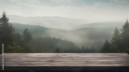 Empty black wooden table against misty in the forest of mountains. 