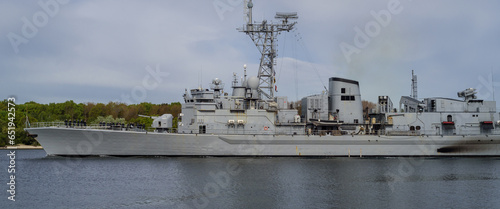 WARSHIP - A modern French Navy frigate sails to the sea port photo