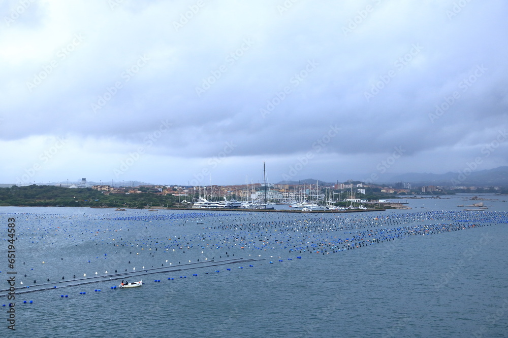 A view to the harbor of Olbia from the sea on a cloudy day, Sardinia, Italy