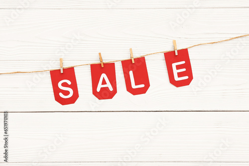 Red sale tags hanging on ro...