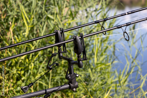 bite alarm for carpfishing, fishing rods and reels, rod pod photo