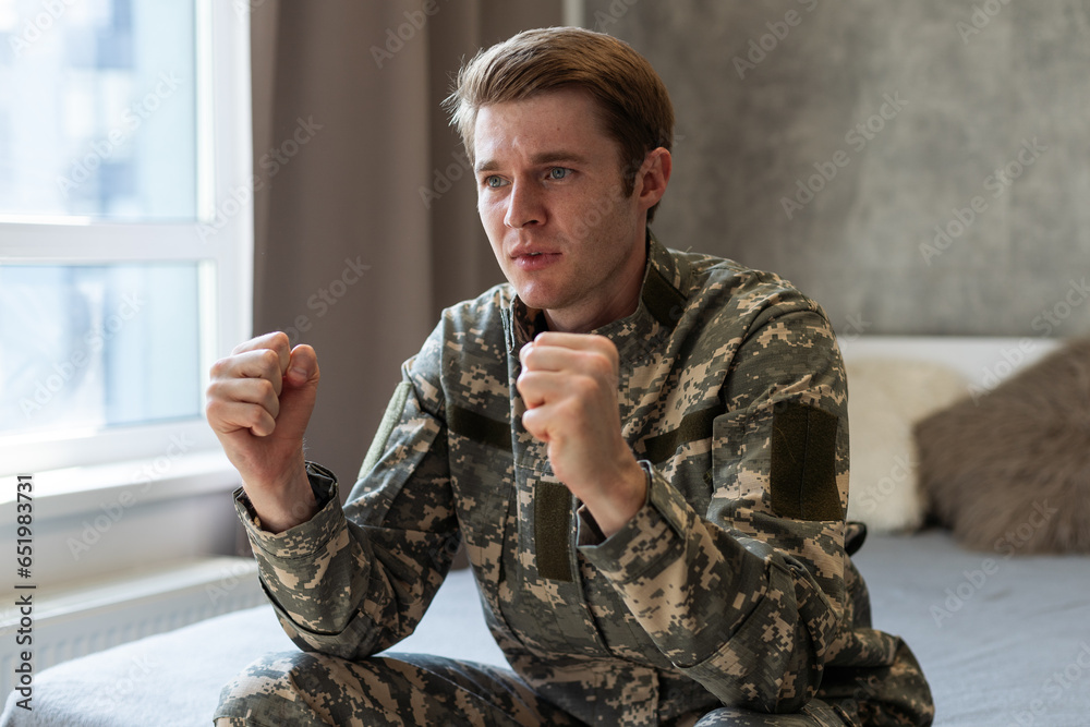 Military man isolated on white background celebrating a victory