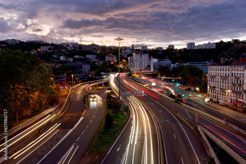 Panoramic photo of the exit of the Fourvière tunnel and the traffic of cars circulating there in Lyon, France at dusk in september 2024.