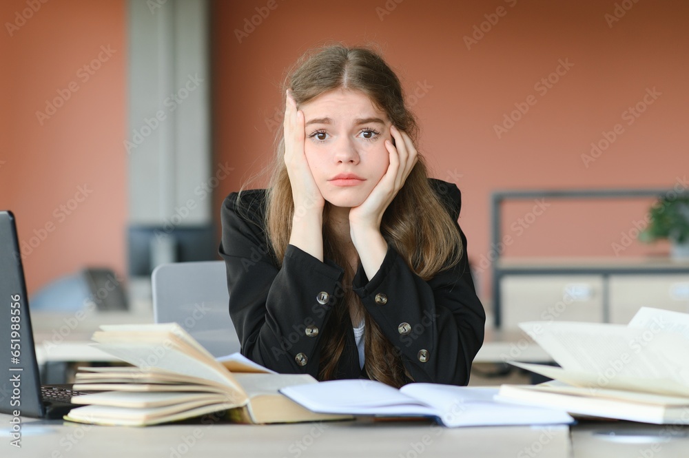 education and school concept - student girl studying and reading book at school. education and school concept - student girl studying and reading book at school.