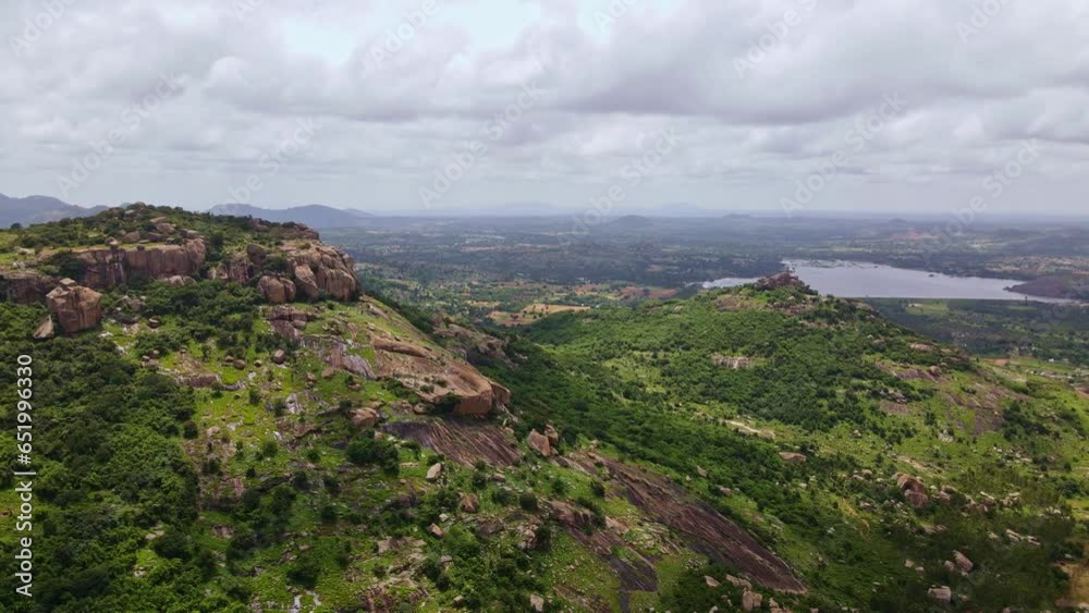 Aerial view of Tumakuru in Karnataka with rocky hills, fields and reservoirs. Drone shot of town in south India Aerial view of Tumakuru in Karnataka with rocky hills, fields and reservoirs. Drone shot of town in south India