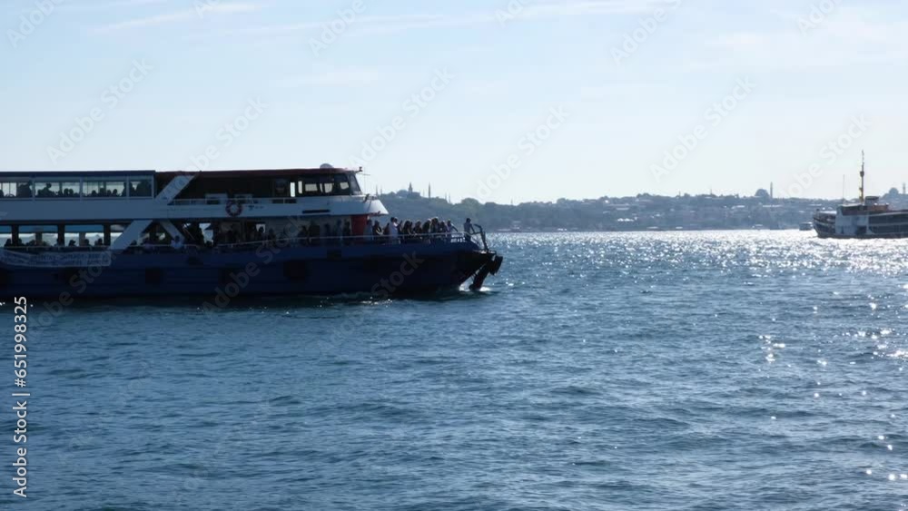 Tour ship, cruise ship traveling on the Bosphorus on a sunny day Tour ship, cruise ship traveling on the Bosphorus on a sunny day