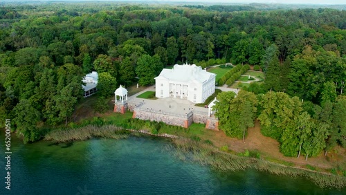 Aerial 4K footage of Uzutrakis Manor in Trakai Galve lake, Lithuania. Video during daylight in autumn photo