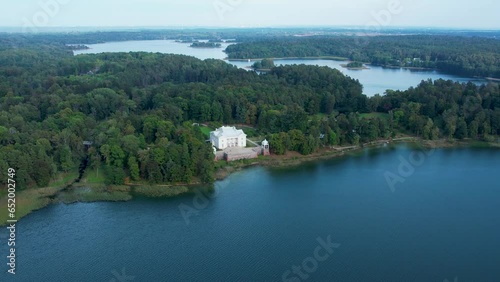 Aerial 4K footage of Uzutrakis Manor in Trakai Galve lake, Lithuania. Video during daylight in autumn photo