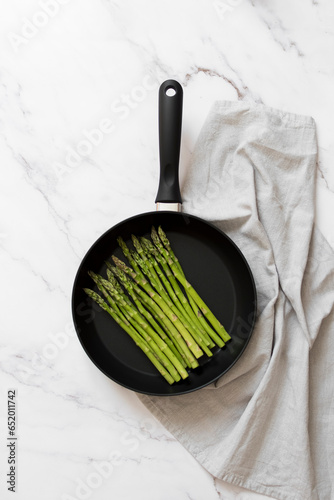 Frying pan with asparagus studio product photography 