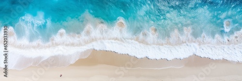 Overhead view of beautiful crystal water waves washing onshore on a pristine beach  sunny day. Tropical shoreline. Aerial drone like view. Generative AI. 