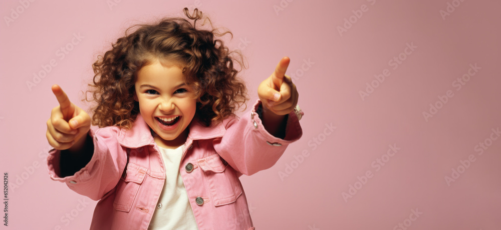 Portrait of smiling hispanic latino schoolgirl isolated on pink background. Back to school concept