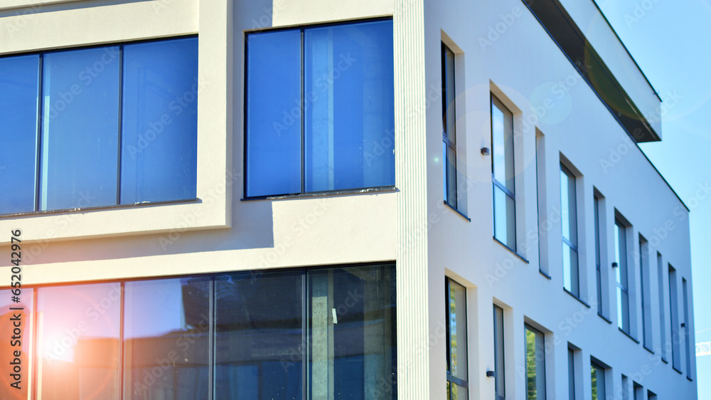 Fragment of glass and metal facade walls. Commercial office buildings. Abstract modern business architecture.