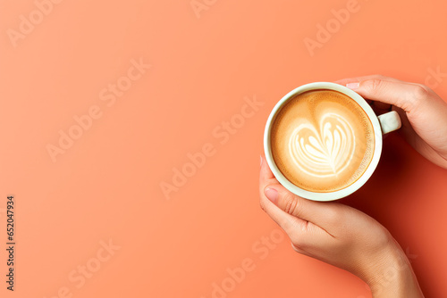 Woman's hands holding a white cup of coffee with a drawing on the foam on a brick colored background with space for text, logo or inscriptions.generative ai 