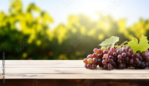 Empty rustic old wooden boards table copy space with blurred vineyard in background. Some grapes on desk. Product display template. Generative AI