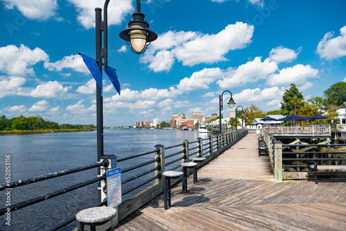 Wooden embankment along the River, Blue sky, snow-white clouds. Wilmington, NC