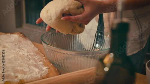 Close-up of a woman's hands, kneading dough and making bread according to recipe, isolated in her home kitchen 4k footage. High quality 4k footage.