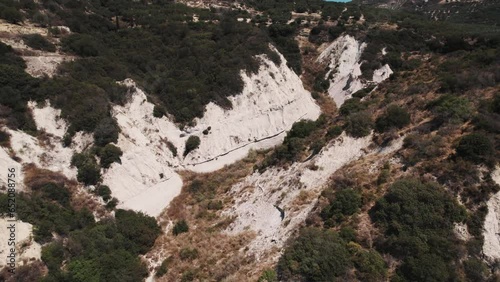 top-down view of bizzare-looking conical hills eroded by winds and rains consisting of grey clay, Komolithi, Greece. High quality 4k footage photo