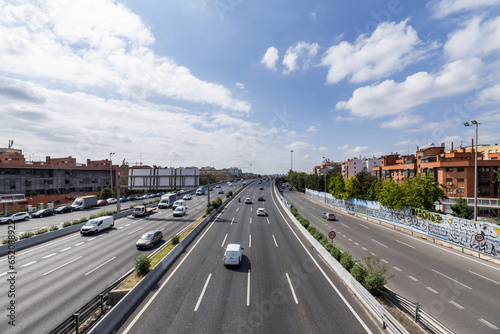Central lanes of the M-30 ring road in the city of Madrid Spain on a day with the sky full of clouds