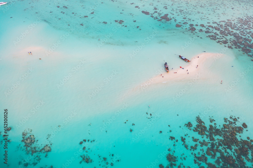 Fototapeta premium Aerial view of clear blue turquoise seawater, Andaman sea in Phuket island in summer season, Thailand. Water in ocean pattern texture wallpaper background.