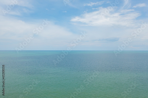Aerial view of clear blue turquoise seawater, Andaman sea in Phuket island in summer season, Thailand. Water in ocean pattern texture wallpaper background. © tampatra