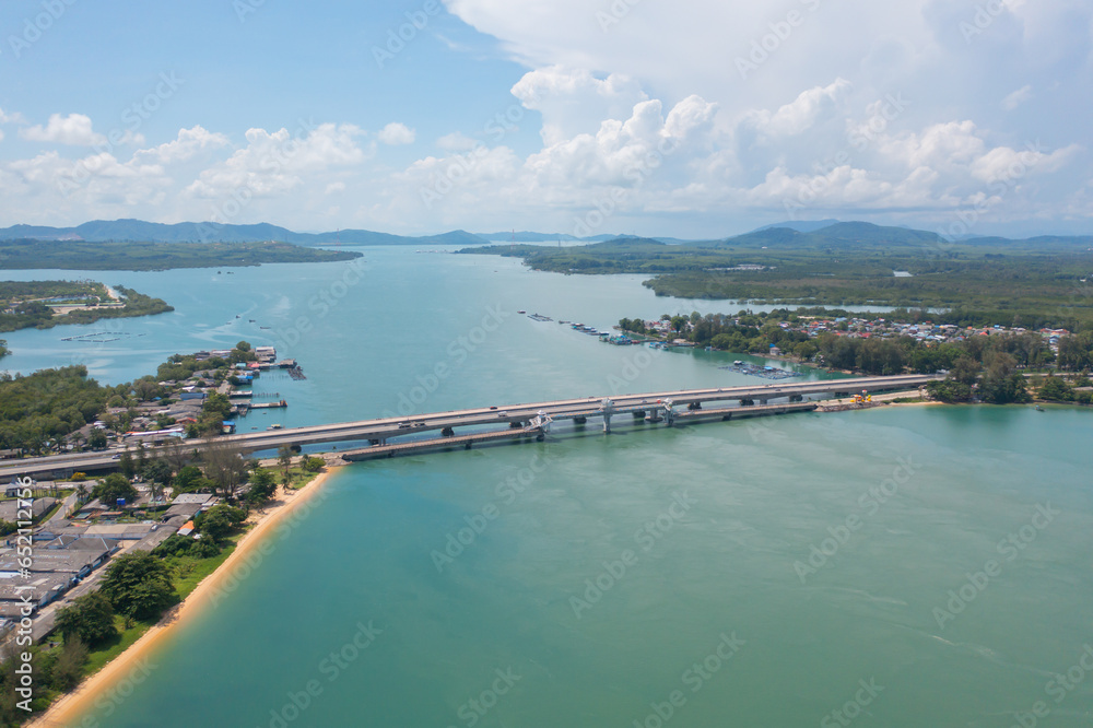 Aerial view of Sarasin Bridge with clear blue turquoise seawater, Andaman sea in Phuket island in summer season, Thailand. Water in ocean material pattern texture wallpaper background.