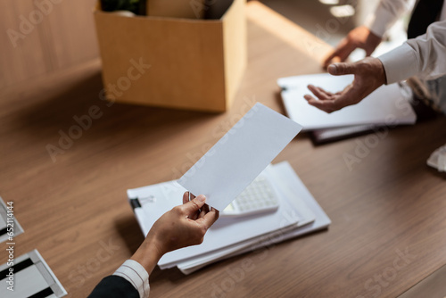 Obraz na plátně Female employer sending resignation letter to male employee for cancel contract