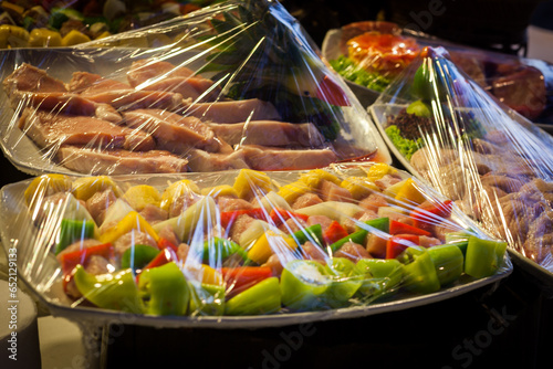 Decoration and raw foods that are wrapped with plastic wrap prepared for the wedding dinner party.