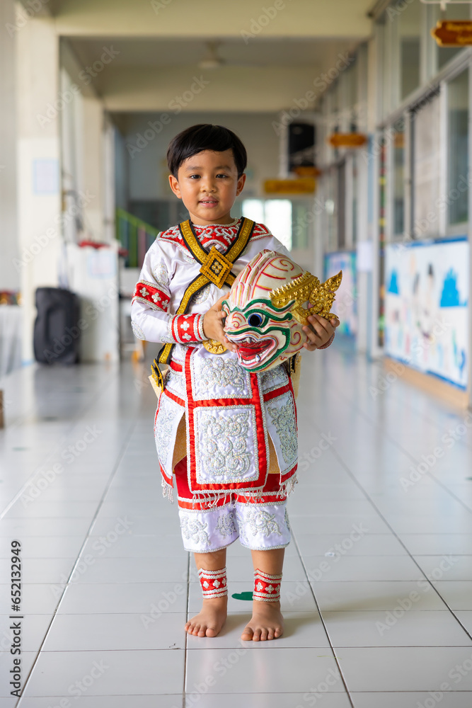 Happy and smile Asian boy wearing Hanuman Khon. Hanuman is Thailand traditional dance. KHON HANUMAN RAMAYANA. masked Khon Hanuman in Literature Ramayana. Happy and smile Asian boy wearing Hanuman Khon. Hanuman is Thailand traditional dance. KHON HANUMAN RAMAYANA. masked Khon Hanuman in Literature Ramayana.