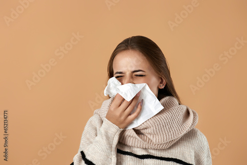 woman in sweater suffering from fever and flu