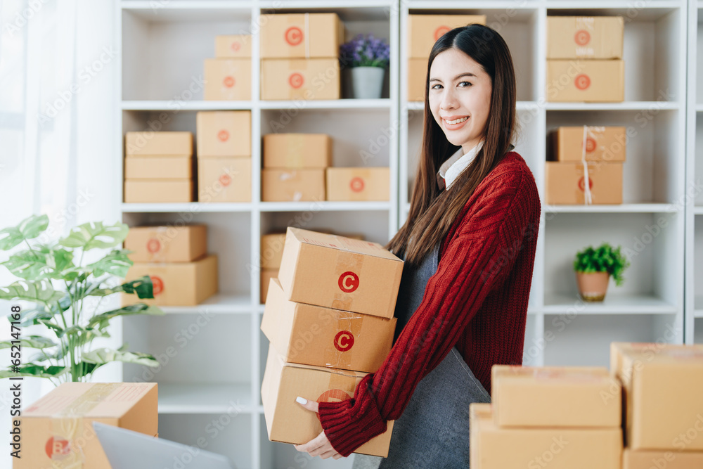 Asian female business owner handles delivery of orders to customers Asian female business owner handles delivery of orders to customers