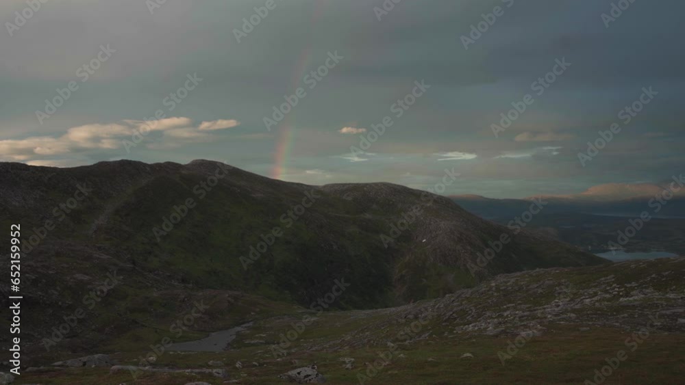 Rainbow Over Grytetippen Peak In Senja, Fjordgard, Norway. Static Shot Rainbow Over Grytetippen Peak In Senja, Fjordgard, Norway. Static Shot