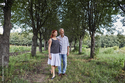 adult couple walking in the park