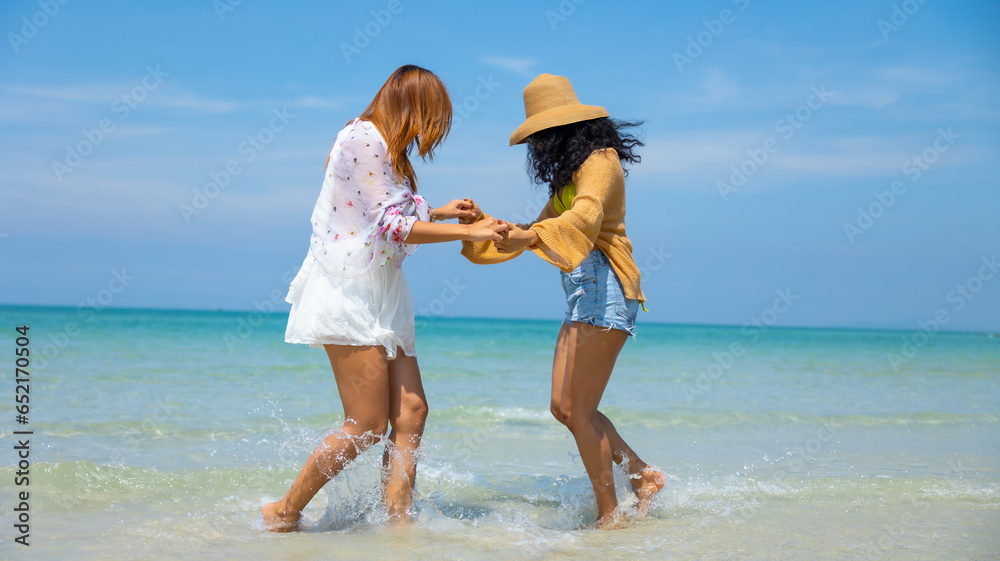 splash water. Happy Couple  or friends Running and traveller enjoy life on Tropical Beach.