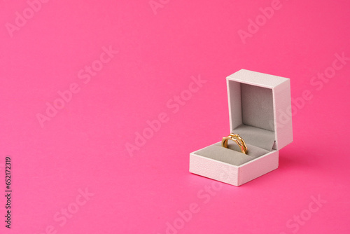 Small jewelry box on pink studio background