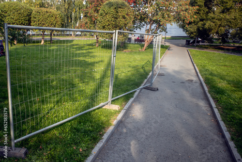Wallpaper Mural Mobile metal sidewalk fencing on an autumn day Torontodigital.ca