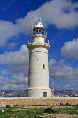 Vertical photo of Paphos Lighthouse, a well known lighthouse on the island of Cyprus, near to the city of Paphos. © Ibolya