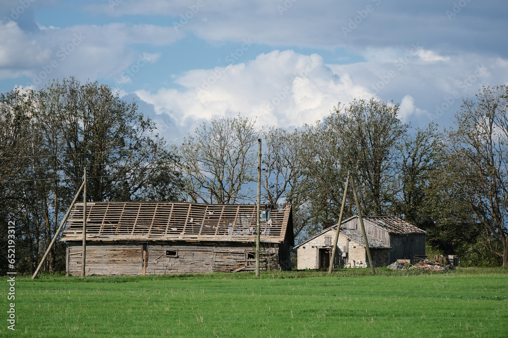 Obraz premium house in countryside with damaged naked roof.