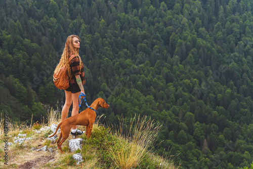Obraz na płótnie Woman Hiker Travel In Mountains with Vizsla Dog w salonie